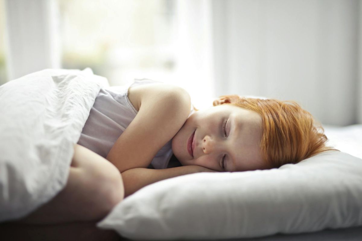 girl lying on bed