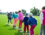 children s team building on green grassland