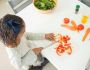 girl slicing bell peppers