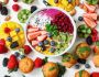 assorted sliced fruits in white ceramic bowl