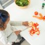 girl slicing bell peppers