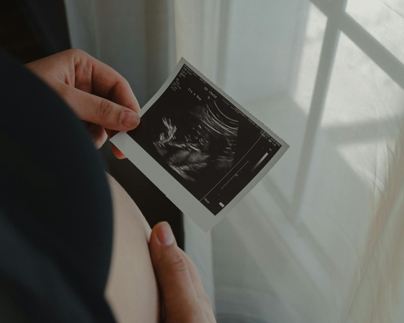 person holding an ultrasound scan photo person holding an ultrasound scan photo person holding an ultrasound scan photo person holding an ultrasound scan photo person holding an ultrasound scan photo person holding an ultrasound scan photo