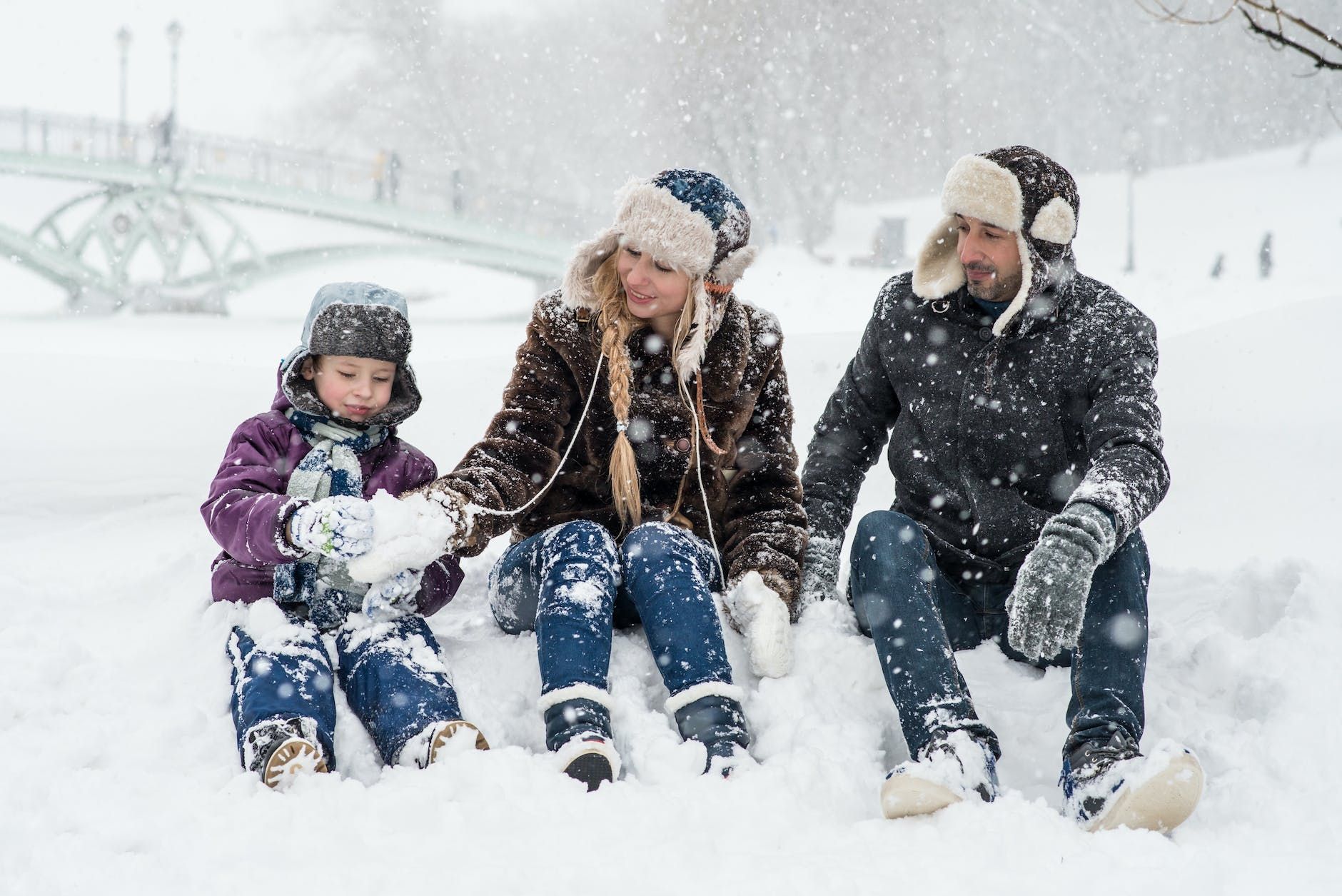 woman man and girl sitting on snow woman man and girl sitting on snow woman man and girl sitting on snow woman man and girl sitting on snow